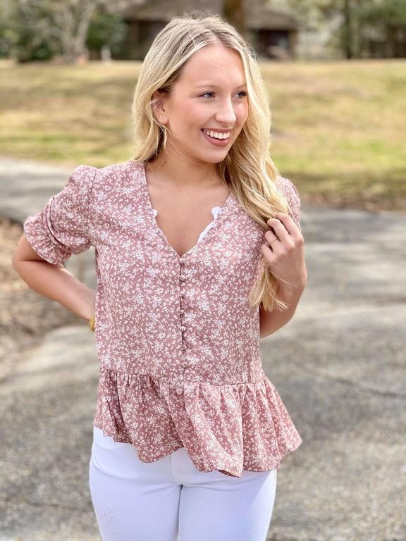 woman wearing pink floral blouse