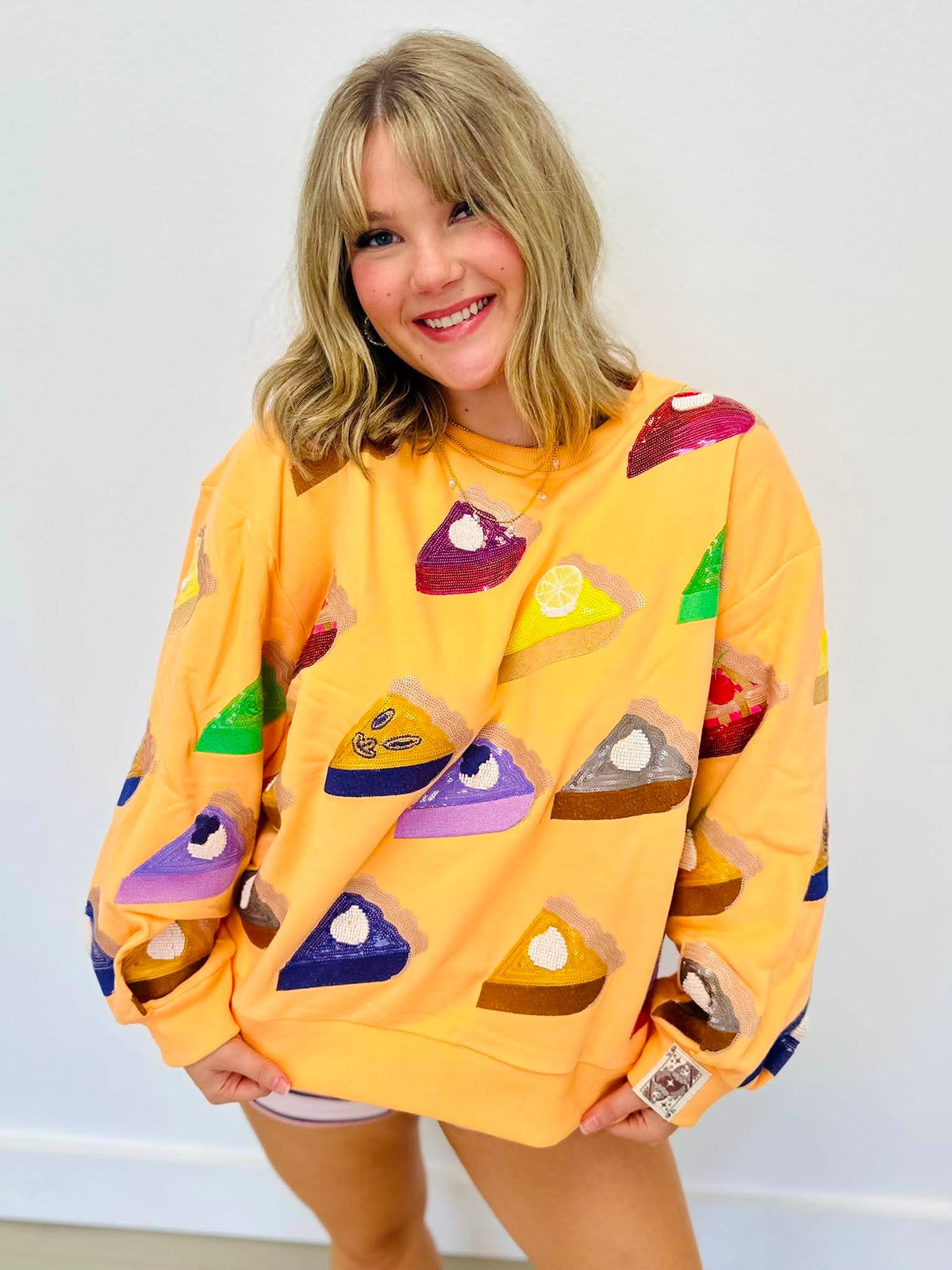 Queen Of Sparkles Peach Multi Pies Sweatshirt